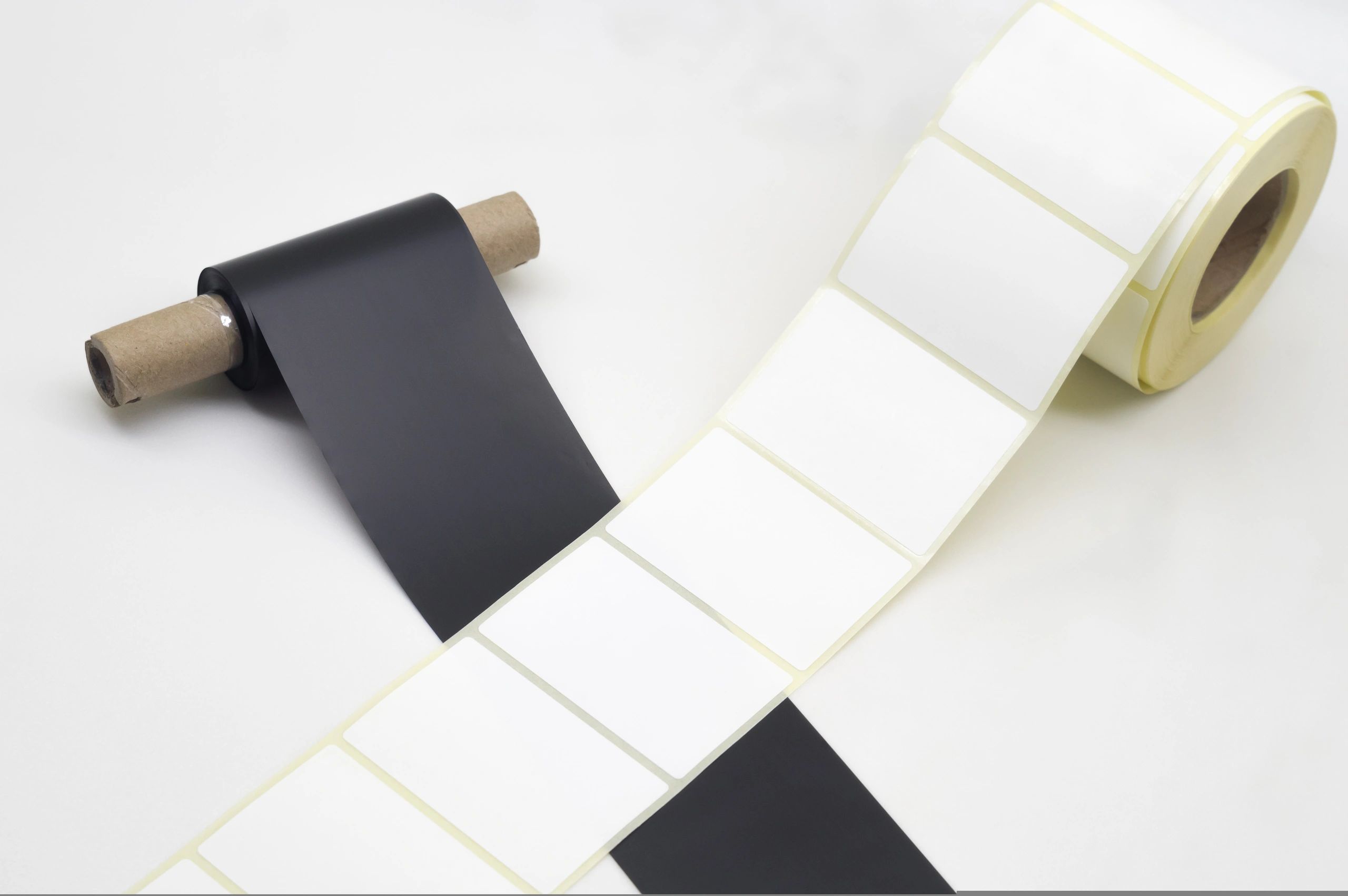 Rolls of labels and thermal transfer ribbon for barcode printing