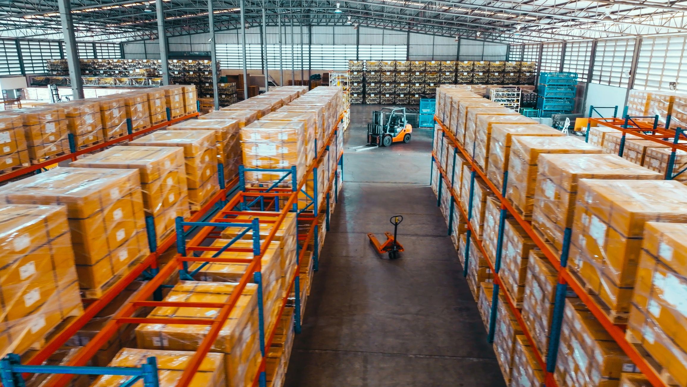 Warehouse aisle with pallets and packaged cartons