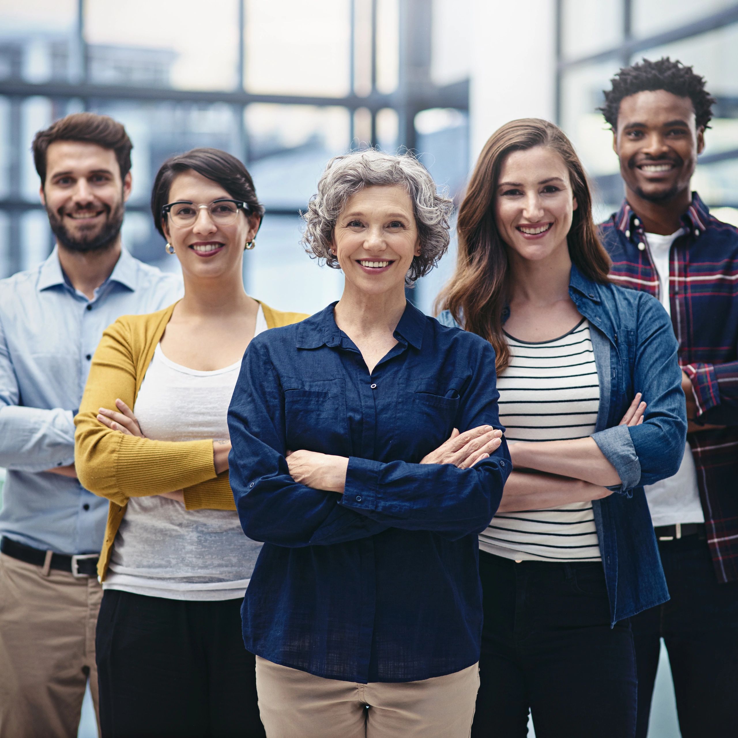Business team standing with arms folded
