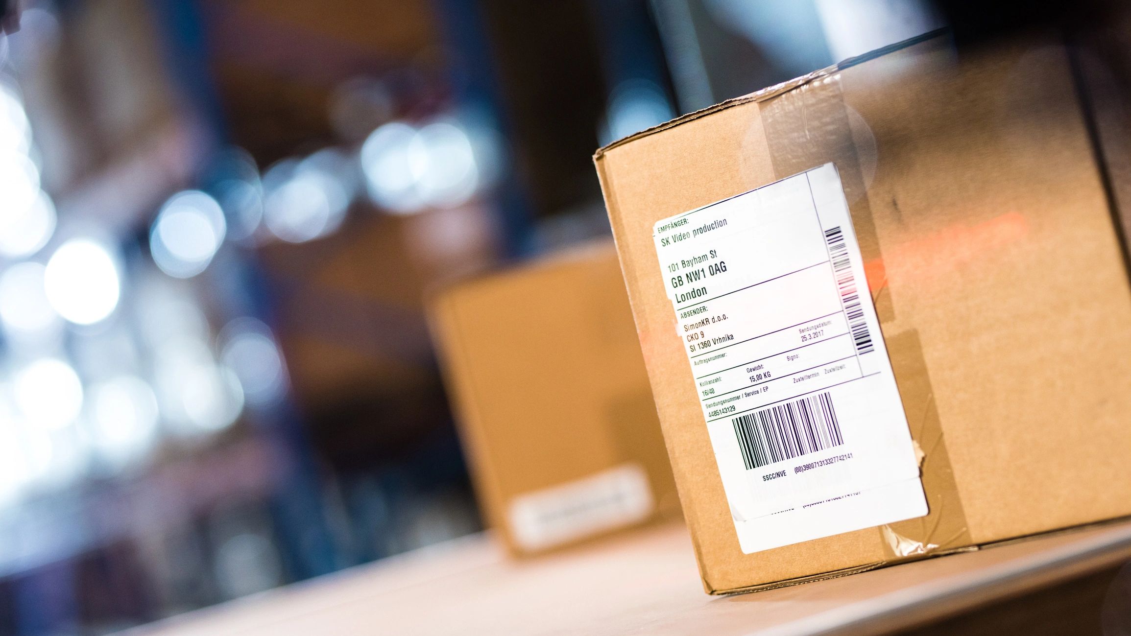 Cardboard box in a warehouse with shipping label area